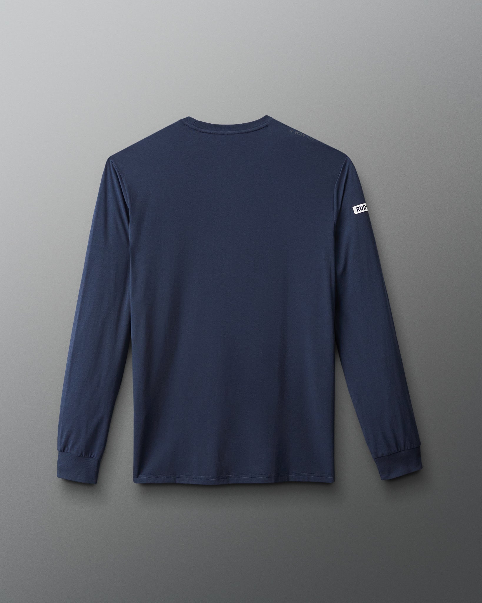 Navy long-sleeve shirt with a logo on the back against a gray background