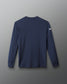 Navy long-sleeve shirt with a logo on the back against a gray background