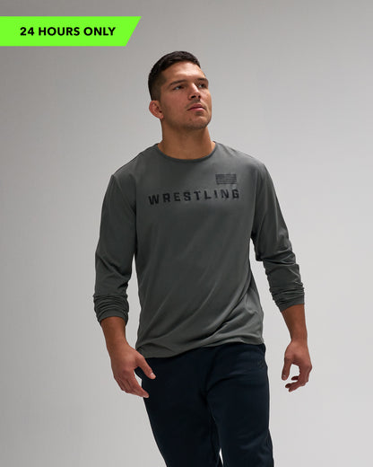 Man wearing a gray long-sleeve shirt with 'Wrestling' text on a gray background