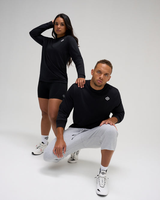 RUDIS Essential Hex Elite Super Soft Long Sleeve T-Shirt in black worn by male and female athletes with RUDIS Hex chest logo.