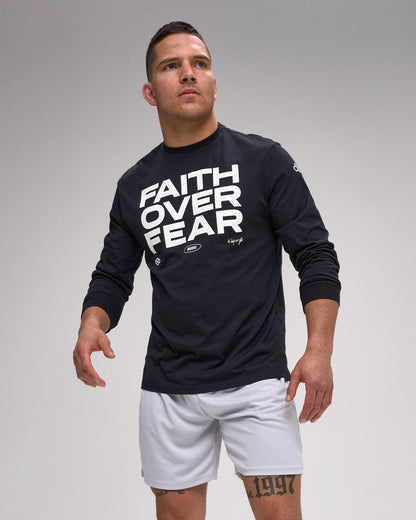 Man wearing a black long-sleeve shirt with 'Faith Over Fear' text on a gray background