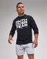 Man wearing a black long-sleeve shirt with 'Faith Over Fear' text on a gray background