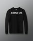 Black long-sleeve shirt with 'A Way of Life' text on a gray background
