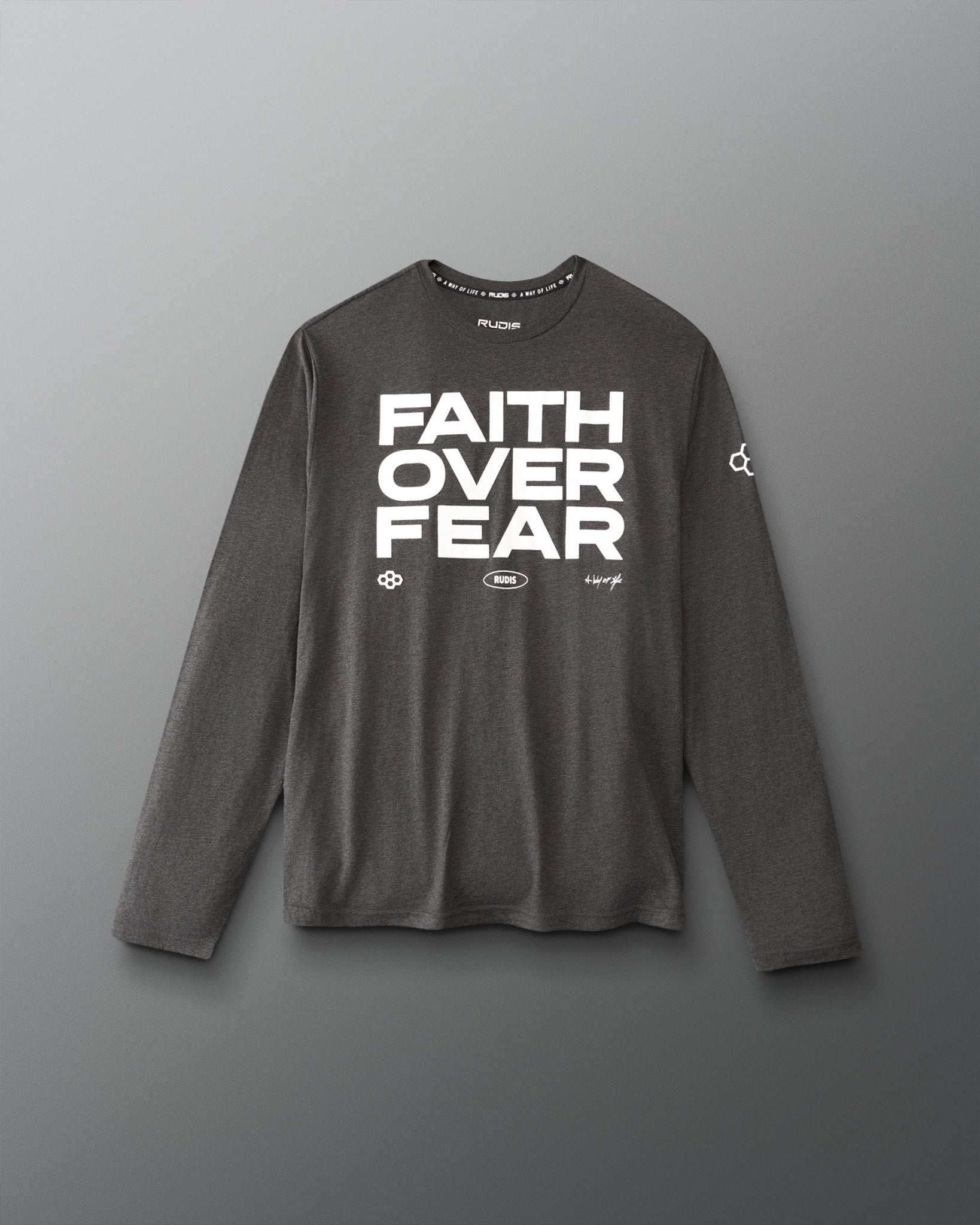 A dark gray long-sleeve athletic shirt with 'FAITH OVER FEAR' printed in bold white letters on the chest, displayed against a neutral gray background.