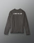 A dark gray long-sleeve t-shirt with 'A WAY OF LIFE' printed in white capital letters across the upper back, displayed against a neutral gray background.