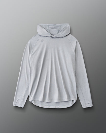 A light gray hooded long-sleeve athletic shirt with a high curved hem, displayed flat against a dark gray gradient background.