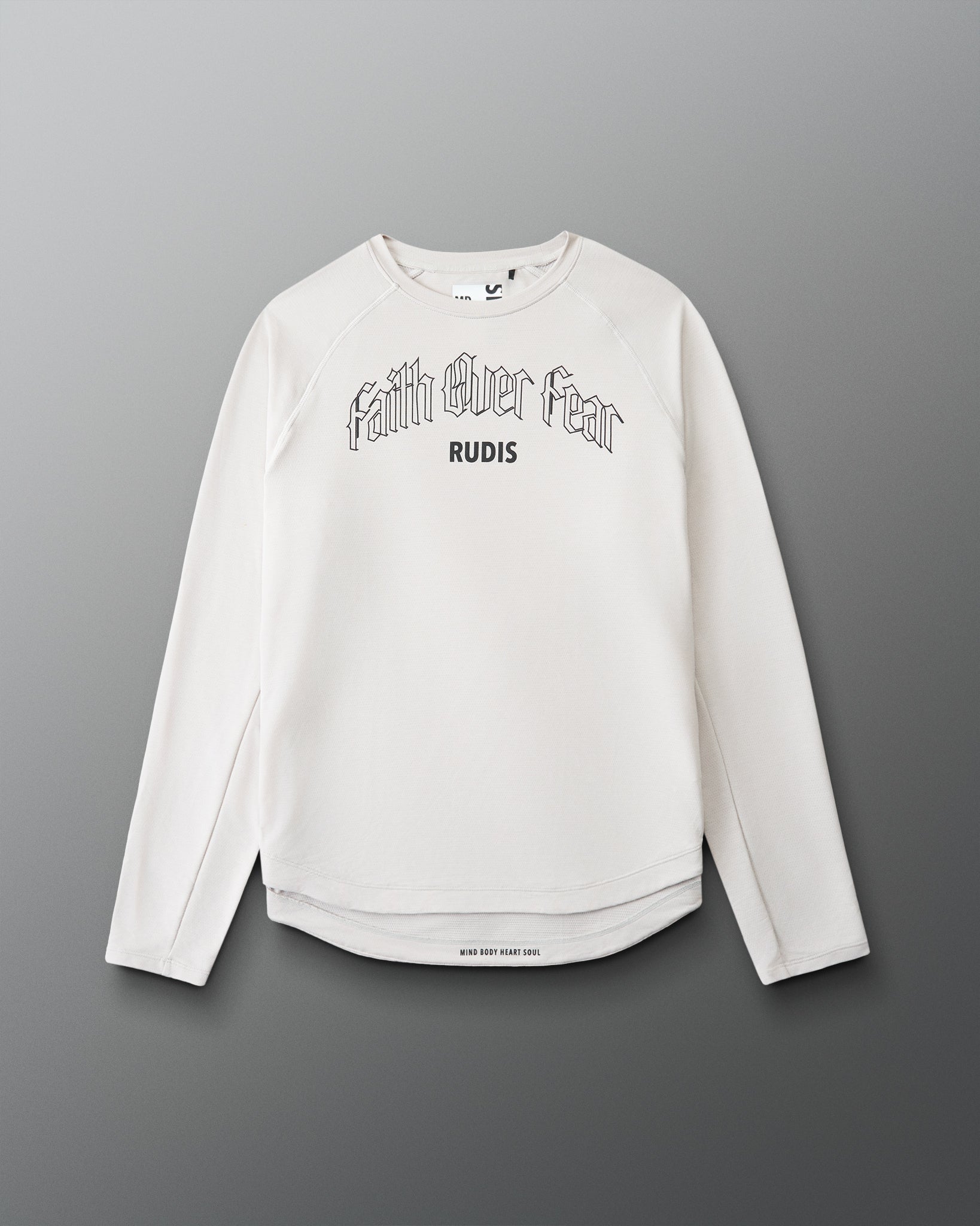 White long-sleeve shirt with 'Faith Over Fear' text on a gray background