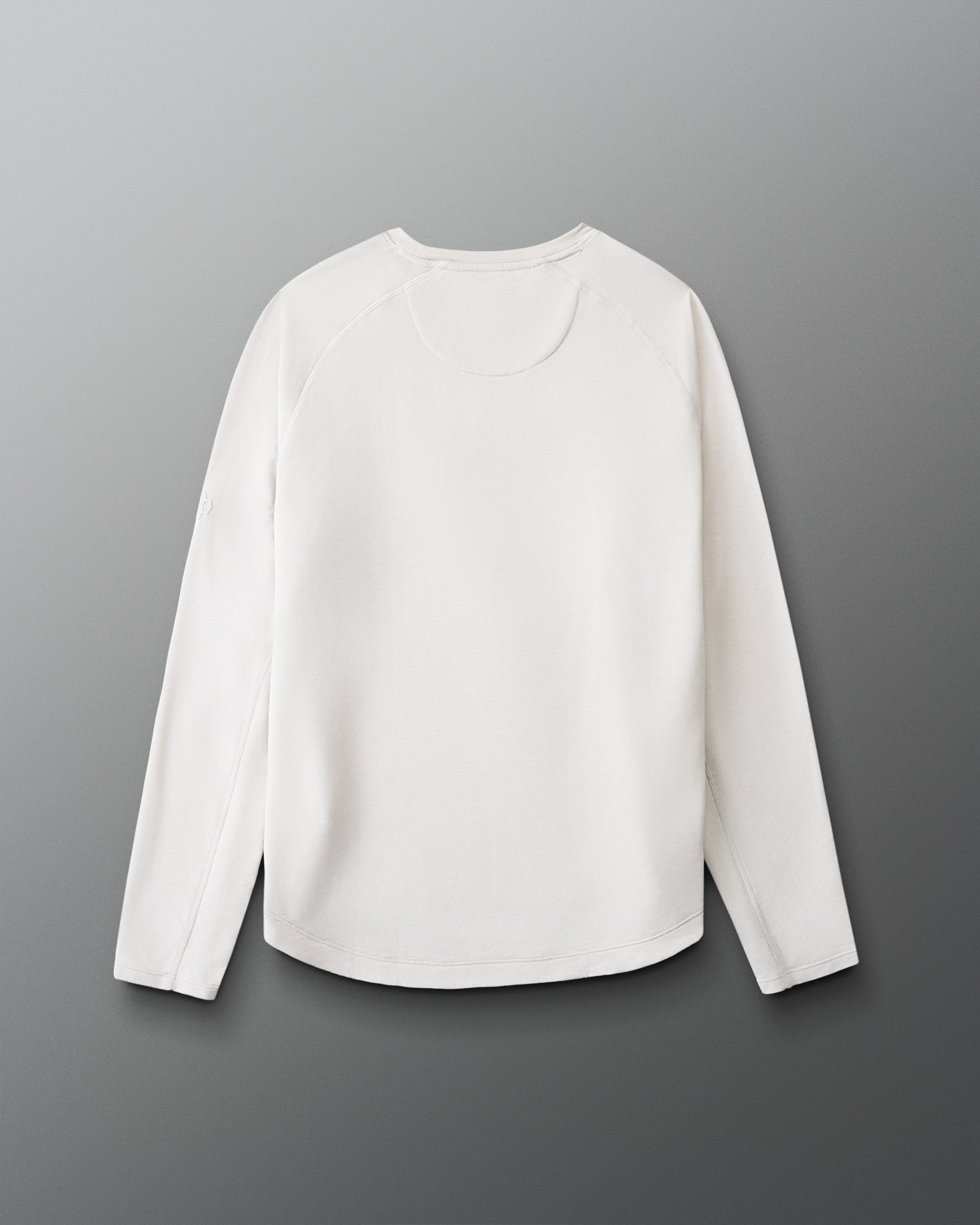 White long-sleeve shirt on a gray background