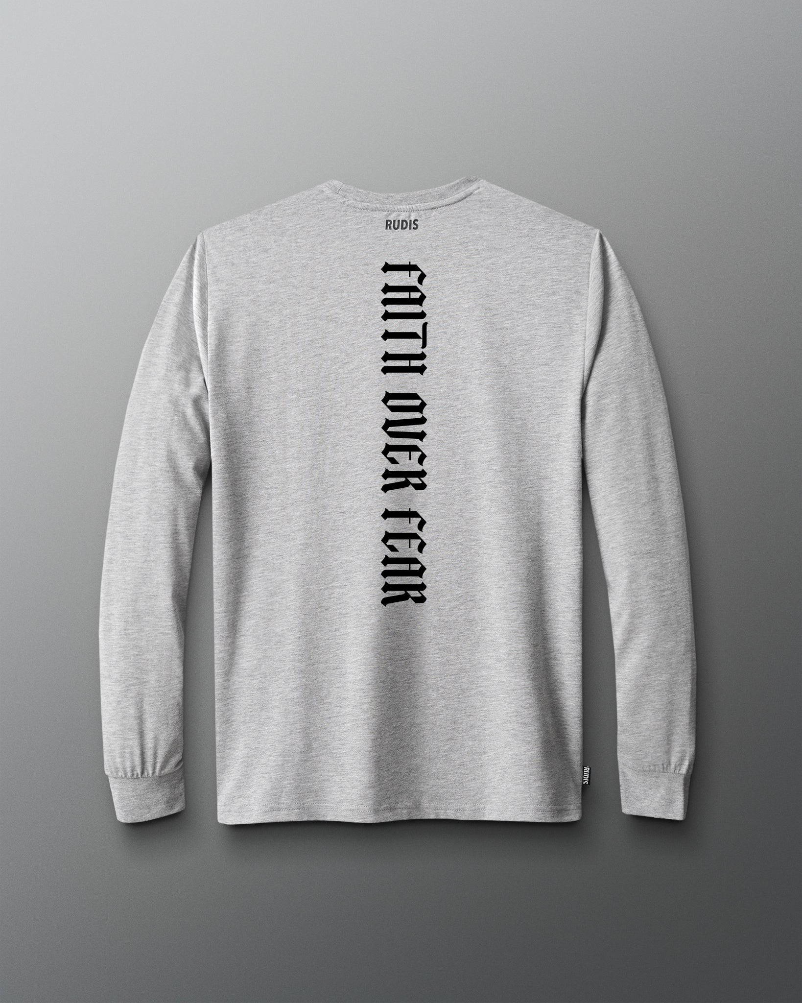 A light heather gray long-sleeve t-shirt shown from the back, featuring the words 'FAITH OVER FEAR' printed vertically in black on the back center. The brand name 'RODIS' is printed in small black letters inside the back collar.
