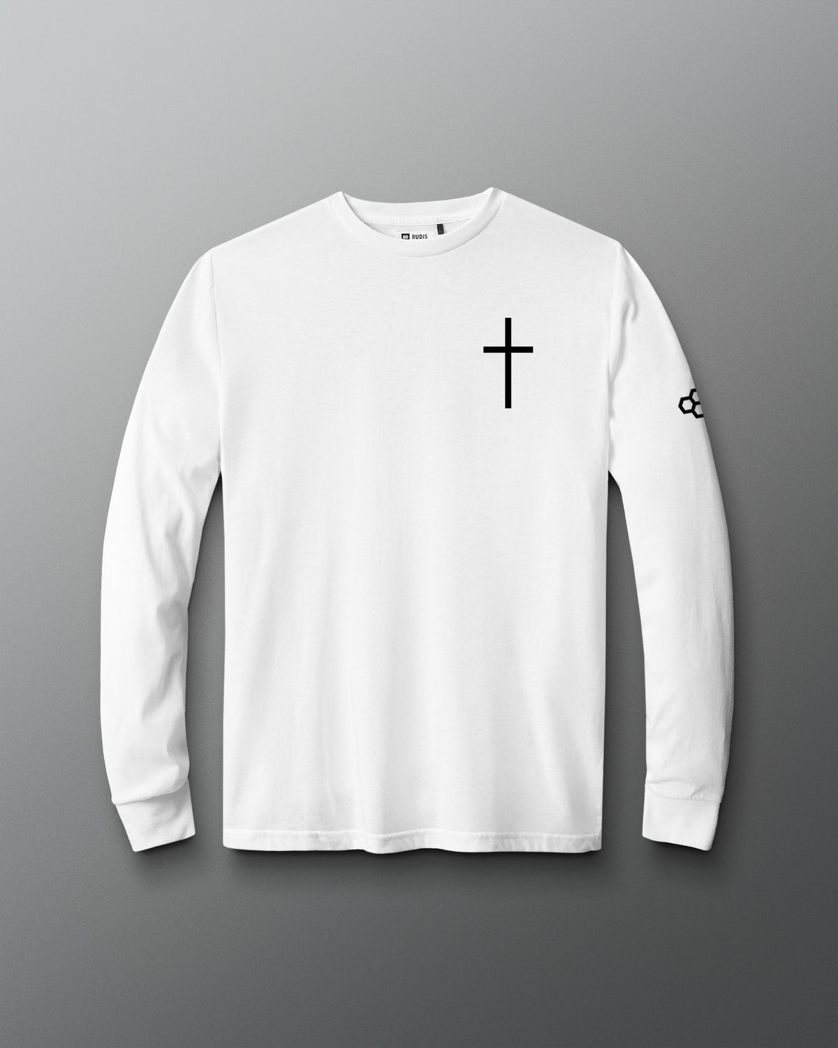 A white long-sleeve crewneck t-shirt with a black cross printed on the left chest and a small black logo on the right sleeve, displayed against a dark gray gradient background.