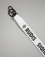 Close-up of the white RUDIS Wordmark lanyard featuring a durable metal key clip, key ring, woven polyester strap, and bold white RUDIS logo with honeycomb icon.
