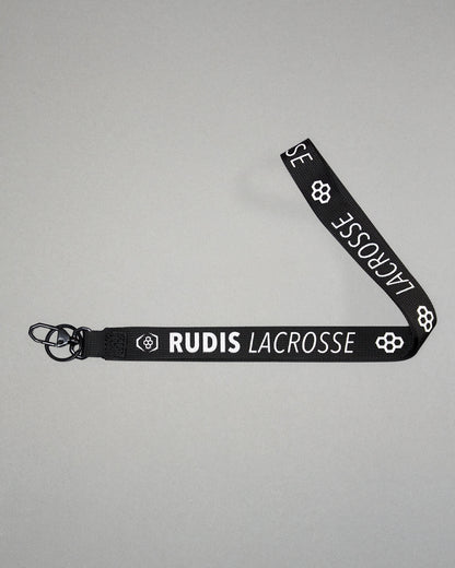 Black RUDIS Lacrosse lanyard with woven logo, durable fabric strap, key ring, and metal clasp.