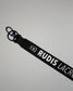 Black RUDIS Lacrosse lanyard with woven logo, durable fabric strap, key ring, and metal clasp.