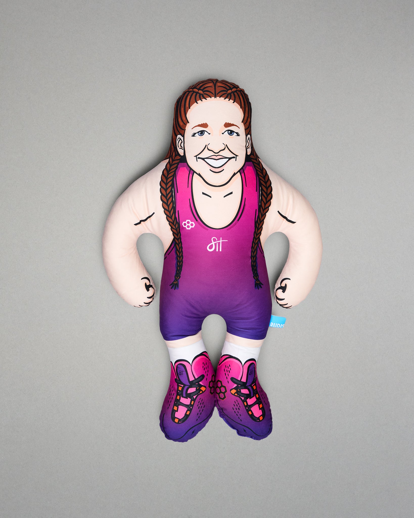 Pillow of a wrestler in a wrestling singlet with a gray background