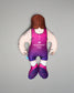 Pillow figure of a wrestler in a pink and purple singlet on a gray background