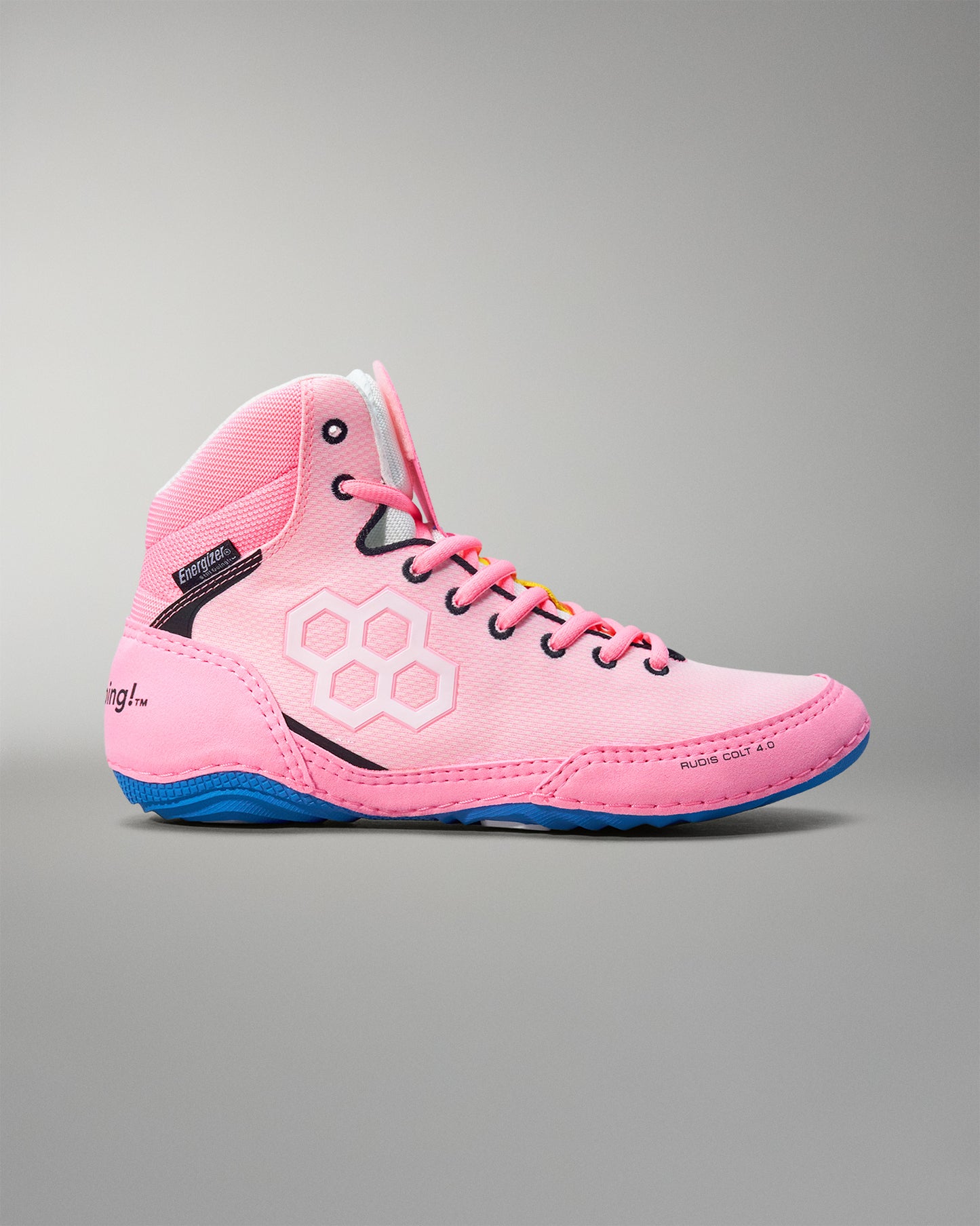 Pink wrestling shoes with blue sole on a gray background