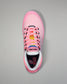 Pink wrestling shoe with colorful accents on a gray background