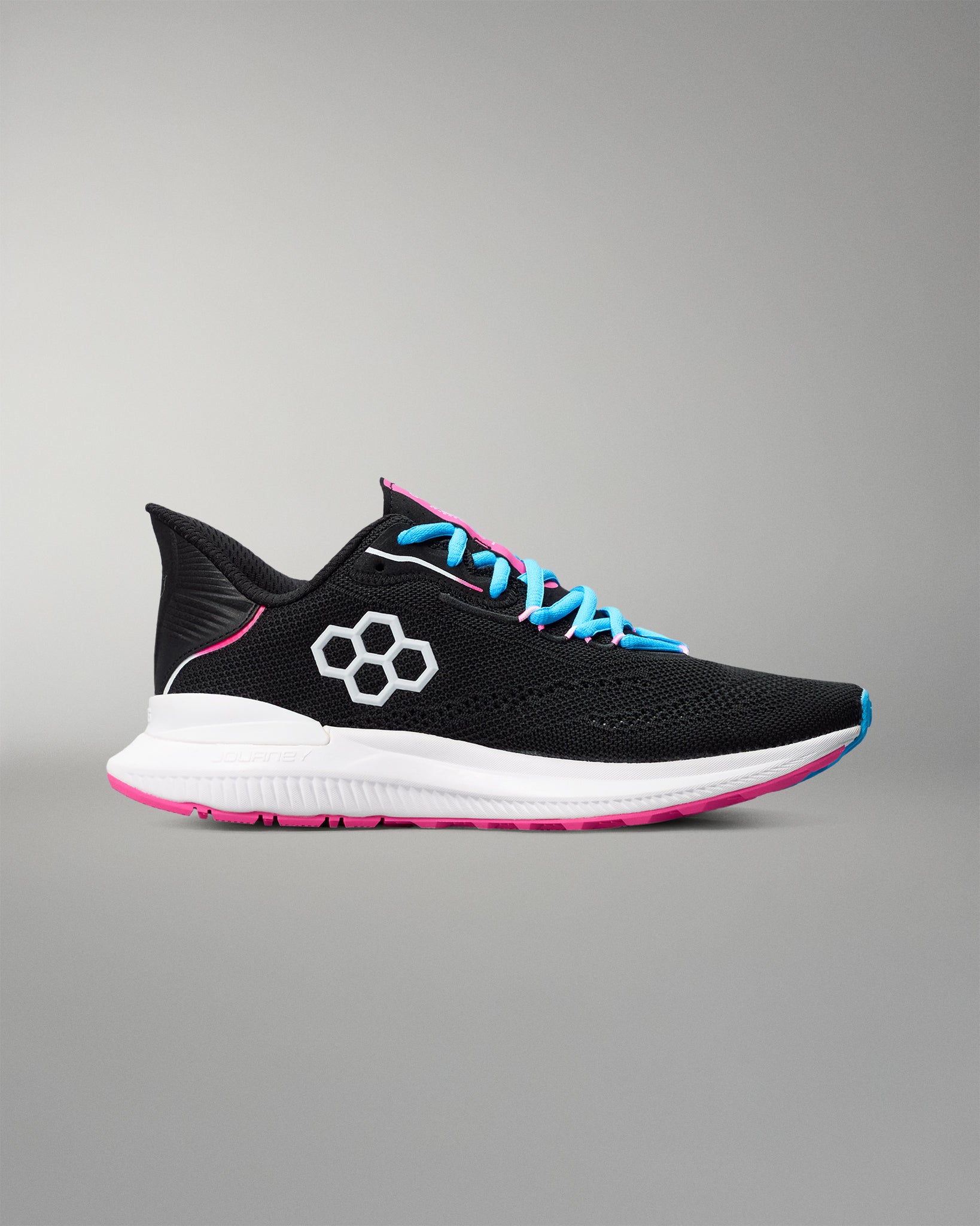 Black running shoe with blue laces and pink sole on a gray background