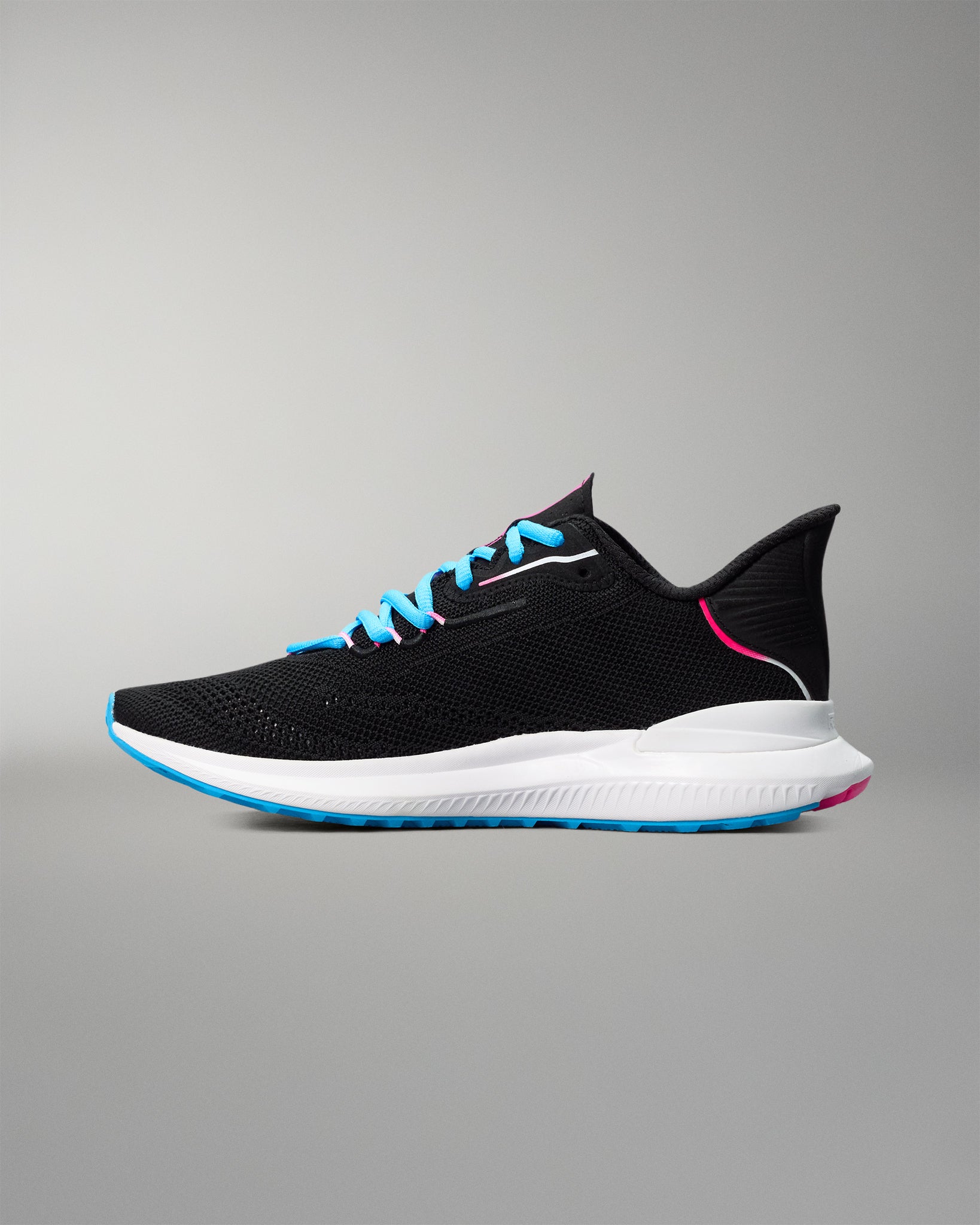 Black running shoe with blue and pink accents on a gray background