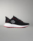 Black running shoe with red accents on a gray background