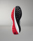 Black and red athletic shoe on a gray background