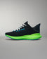 Black running shoe with green sole on a gray background