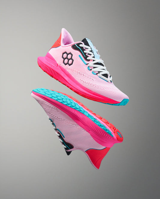 Pink and blue athletic shoes on a gray background