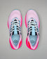 Pair of pink and black running shoes with blue accents on a gray background