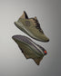 Pair of green training shoes on a gray background