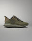 Green training shoe on a gray background