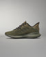 Green training shoe on a gray background