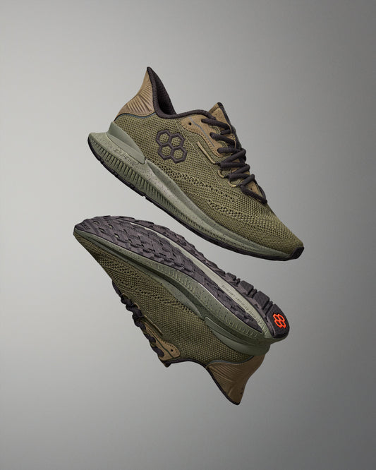 Pair of green training shoes on a gray background