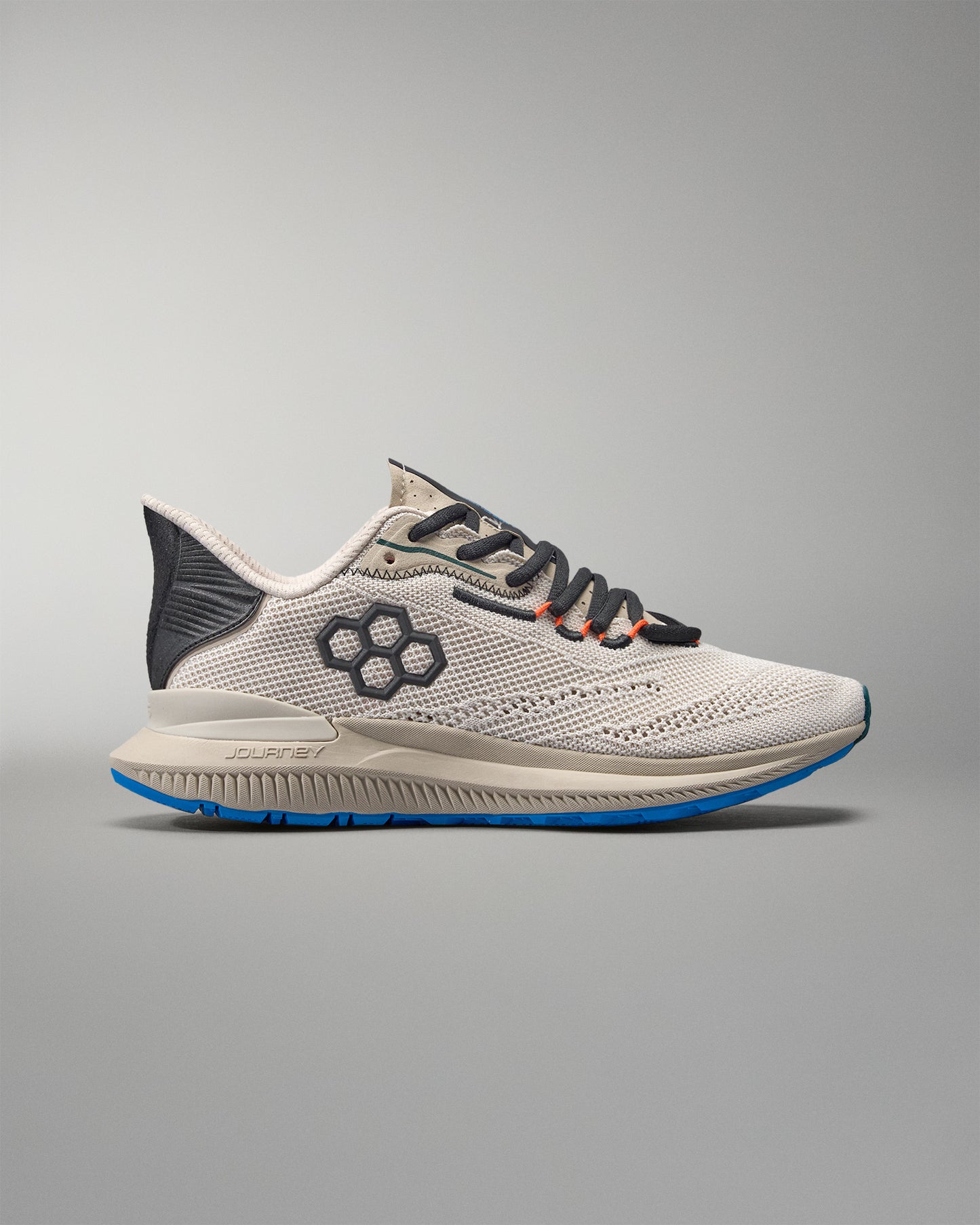 White running shoe with black and blue accents on a gray background