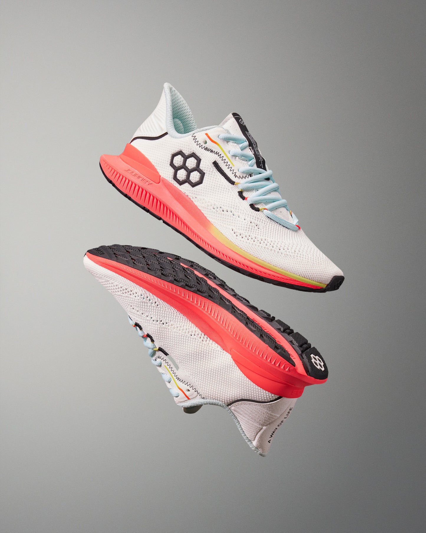 White running shoes with colorful accents on a gray background