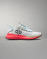 White running shoe with colorful sole on a gray background