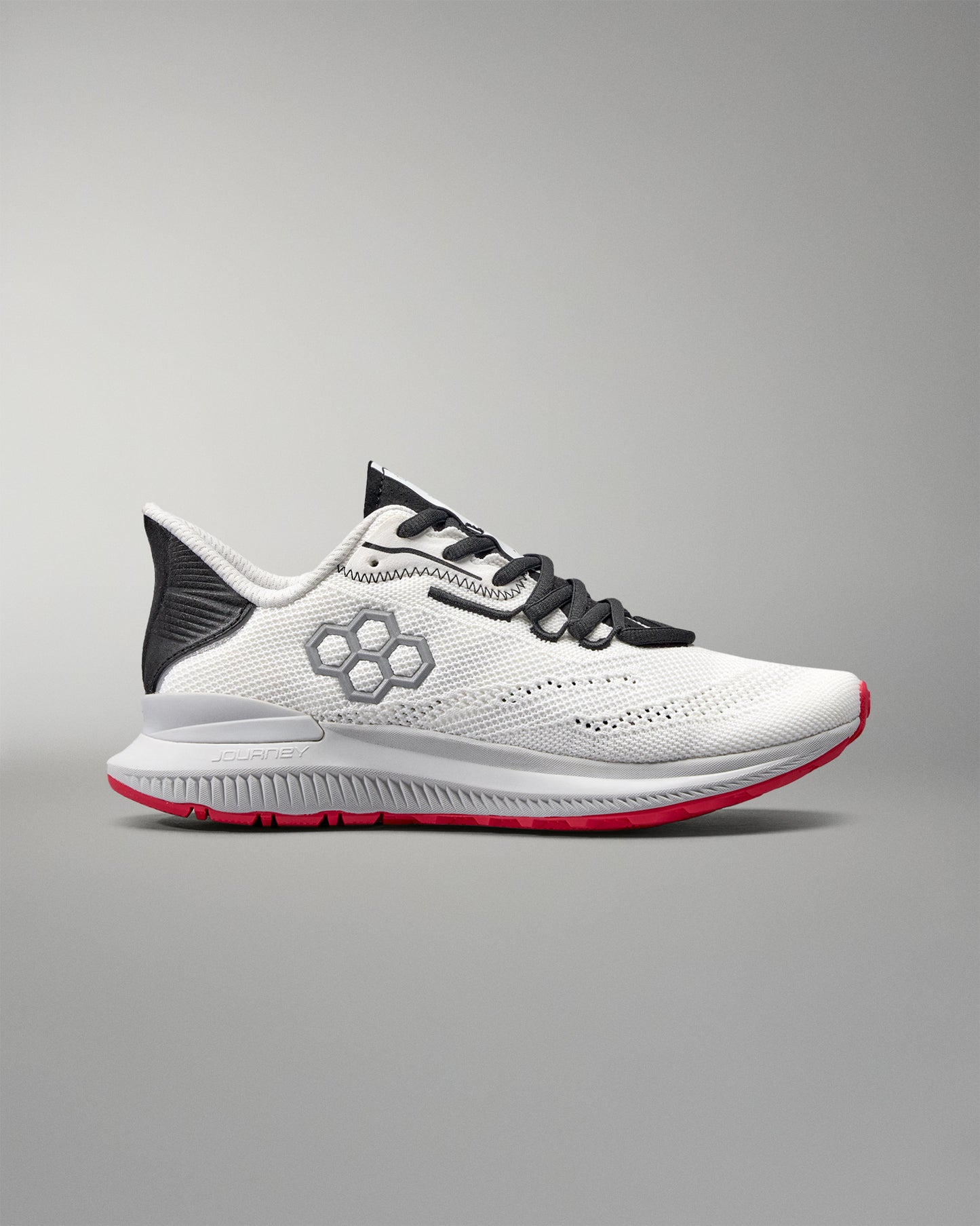 White running shoe with black and red accents on a gray background