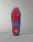 A vibrant purple shoe sole featuring red accents and textured grips designed for optimal traction