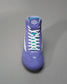 A vibrant purple wrestling shoe featuring a sleek design textured material and white laces ideal for performance on the mat