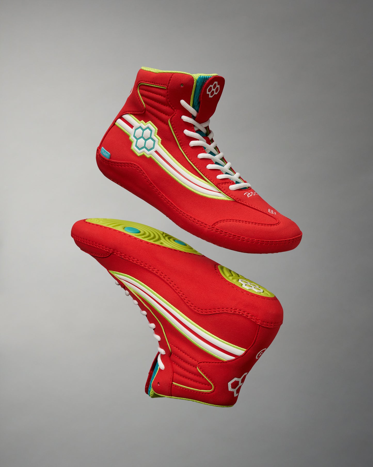 A pair of vibrant red high-top sneakers with unique design elements showcasing a modern style and attention to detail