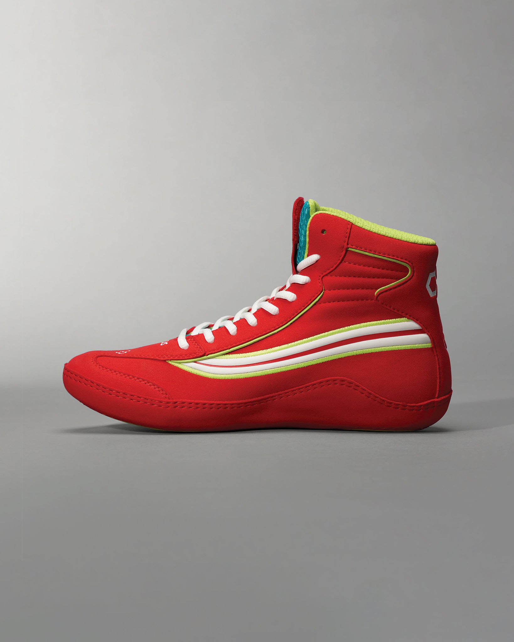 High-top red athletic shoes featuring a sleek design with white and yellow accents