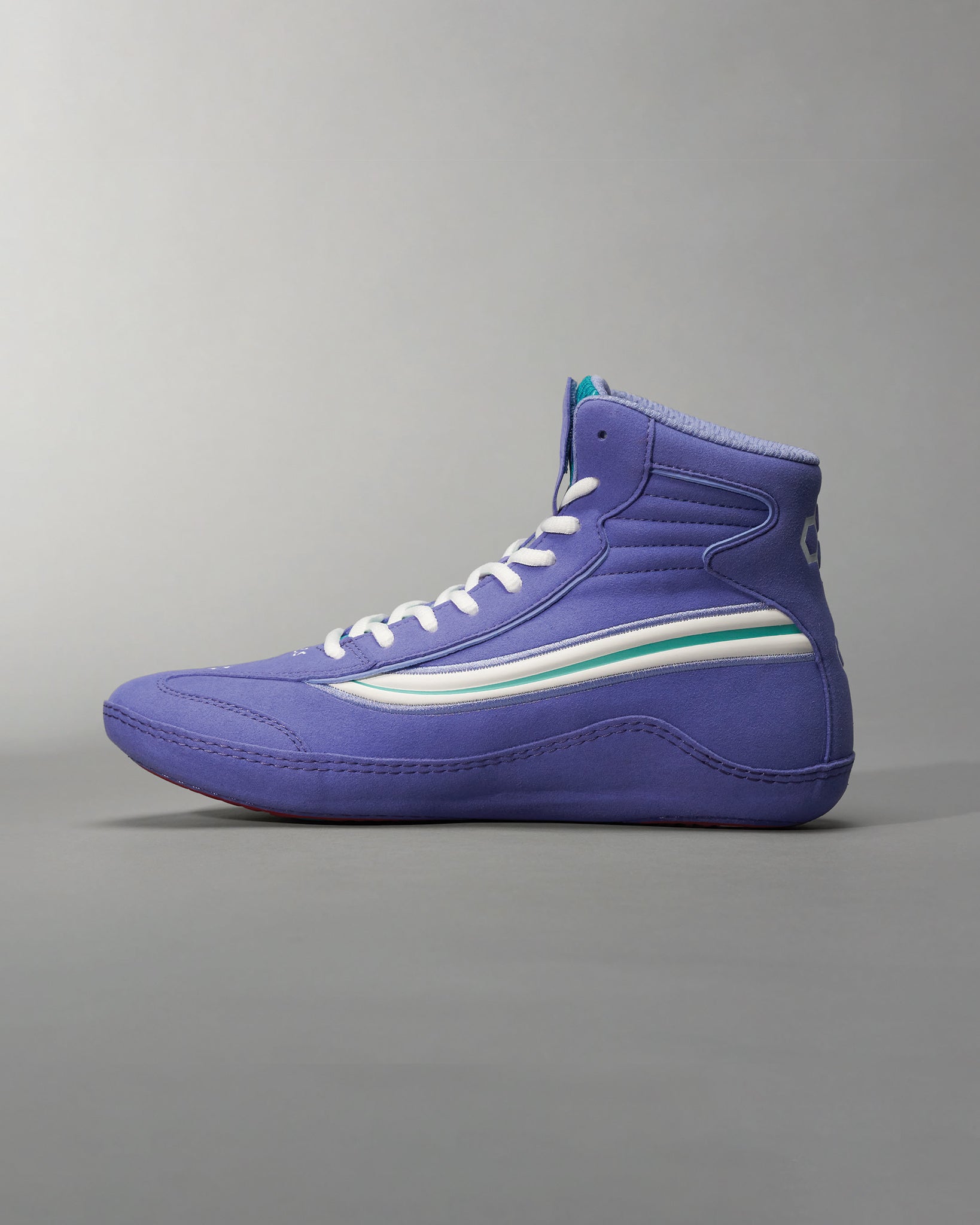 A stylish purple high-top sneaker featuring a sleek design white laces and a unique stripe pattern