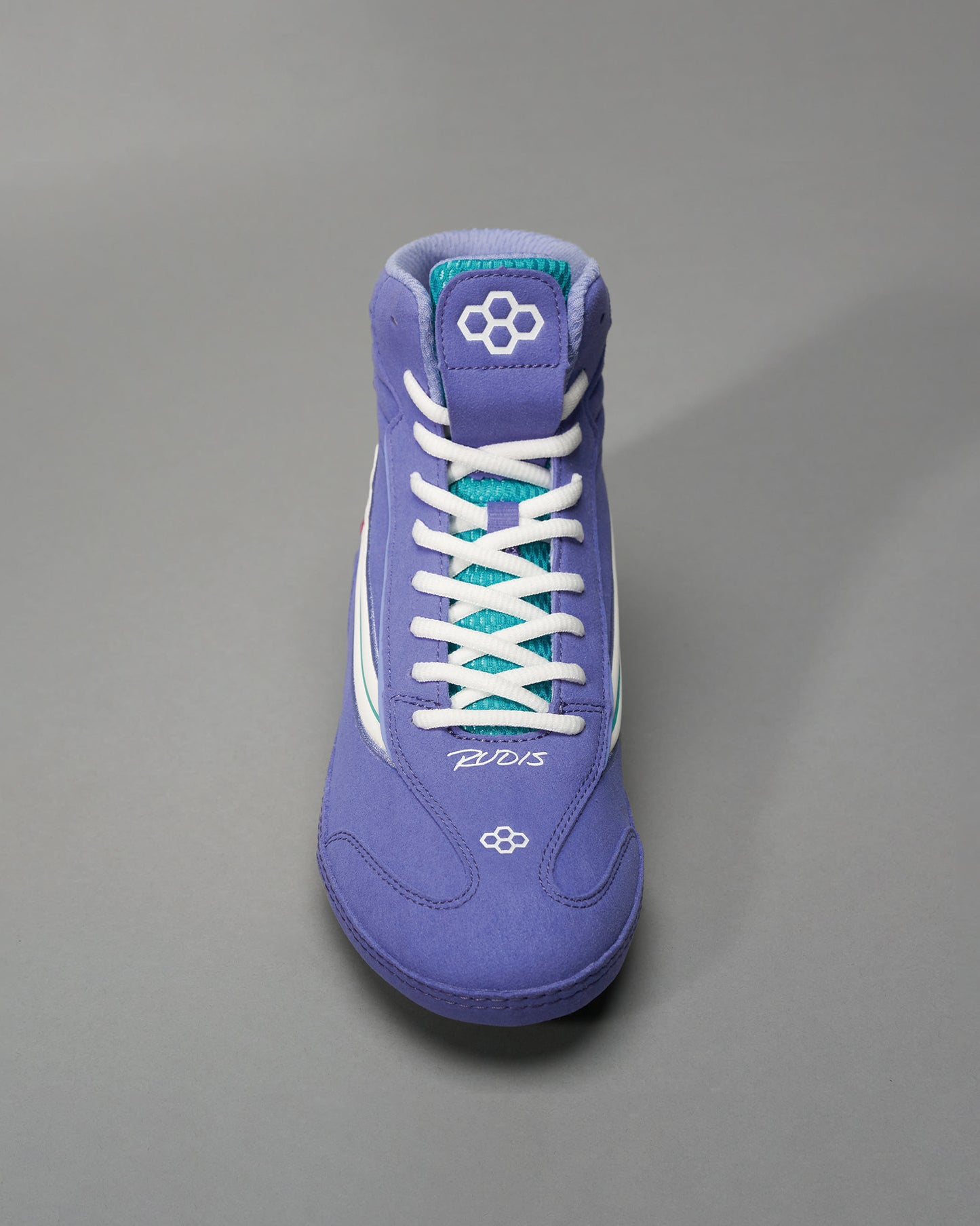 A vibrant purple athletic shoe designed for wrestling featuring a padded collar white laces and contrasting teal elements for added style and support