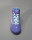 A vibrant purple athletic shoe designed for wrestling featuring a padded collar white laces and contrasting teal elements for added style and support