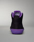 Black high-top sneaker with purple accents on a gray background