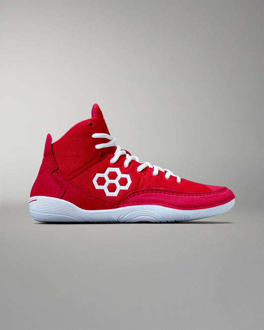 Side view - A pair of crimson red adult wrestling shoes with white laces and a distinctive flower logo on the side.