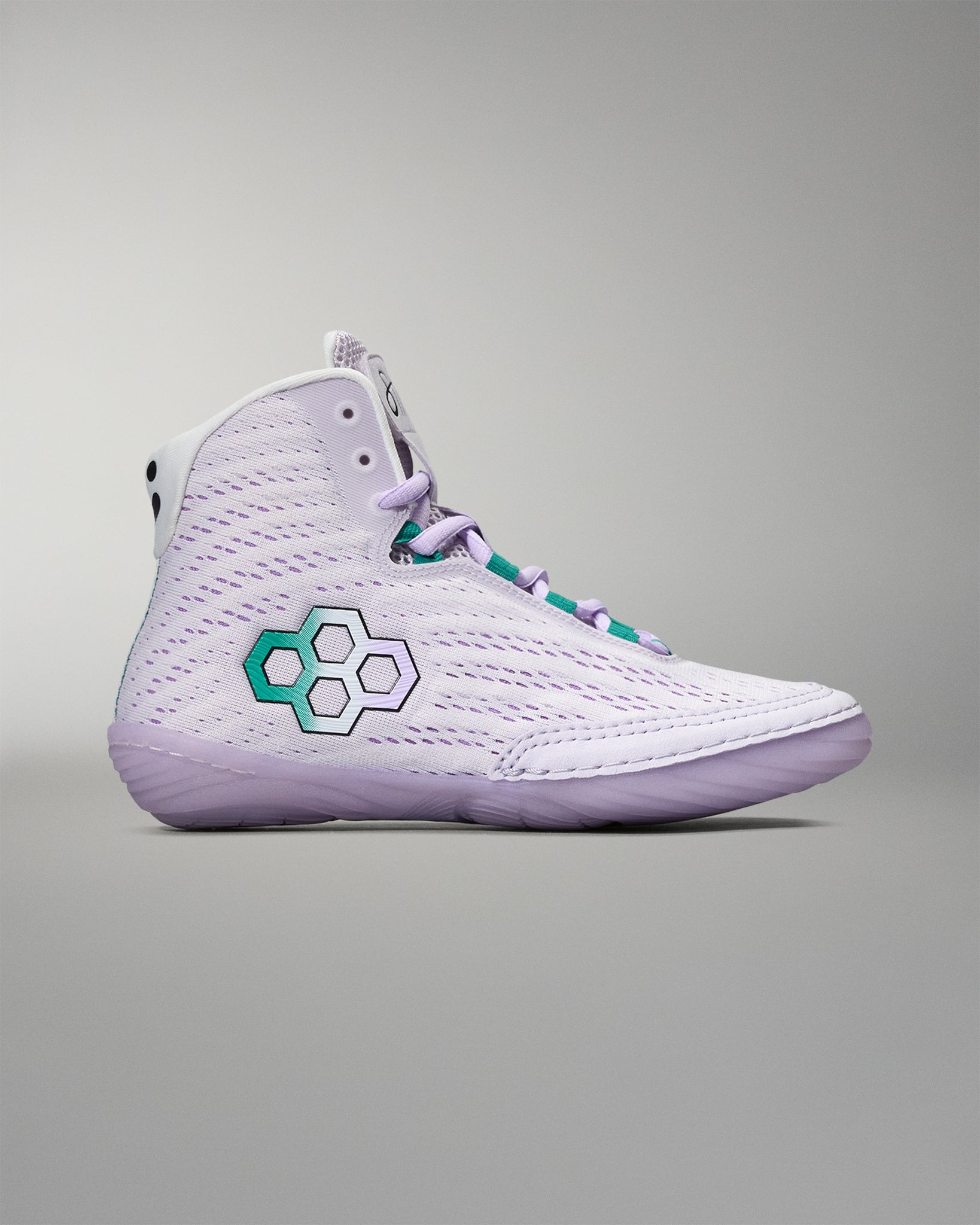 White high-top sneaker with a green and white logo on a gray background