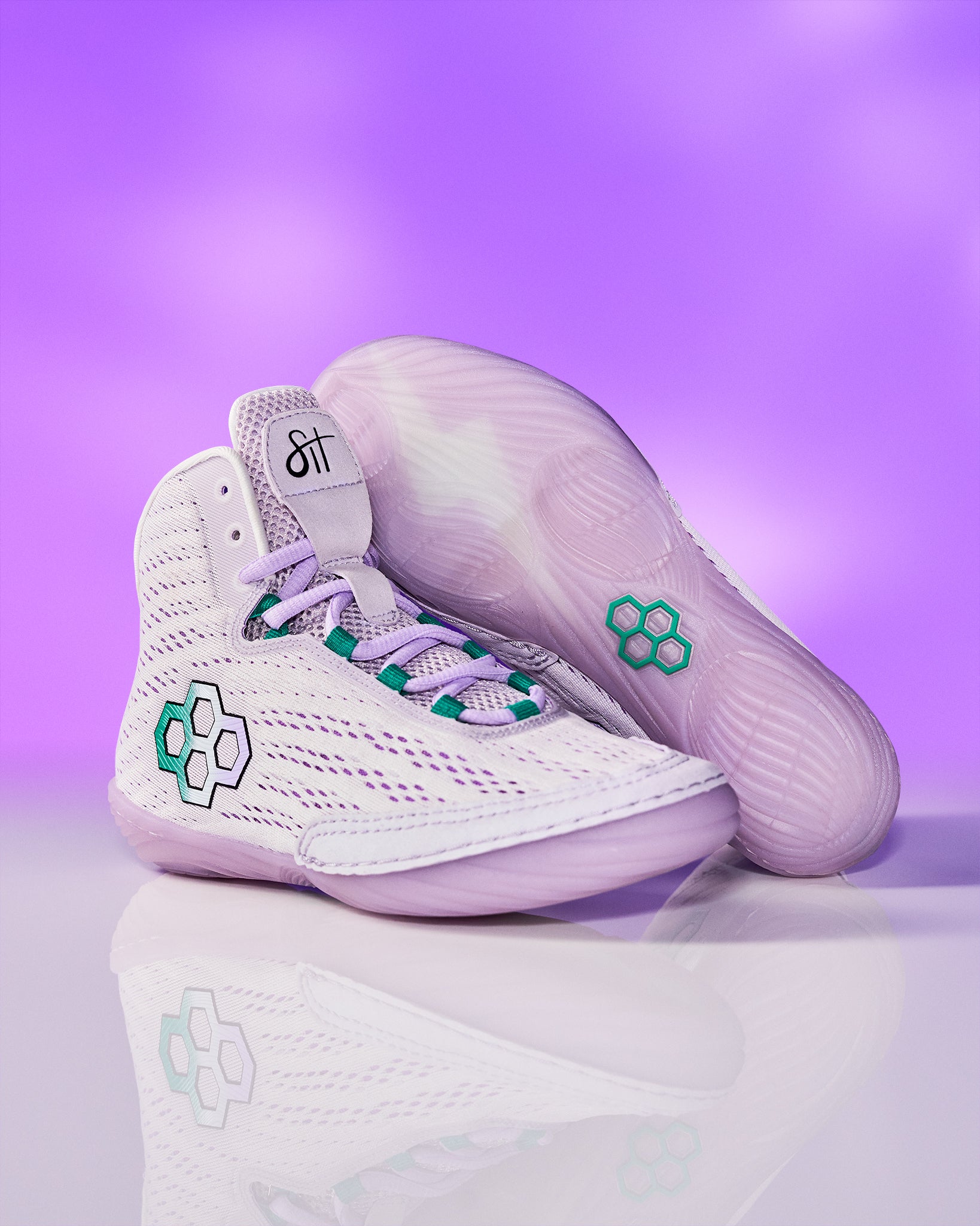 White sneakers with green accents on a purple background