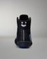 Black sneaker with a smiley face design on a gray background