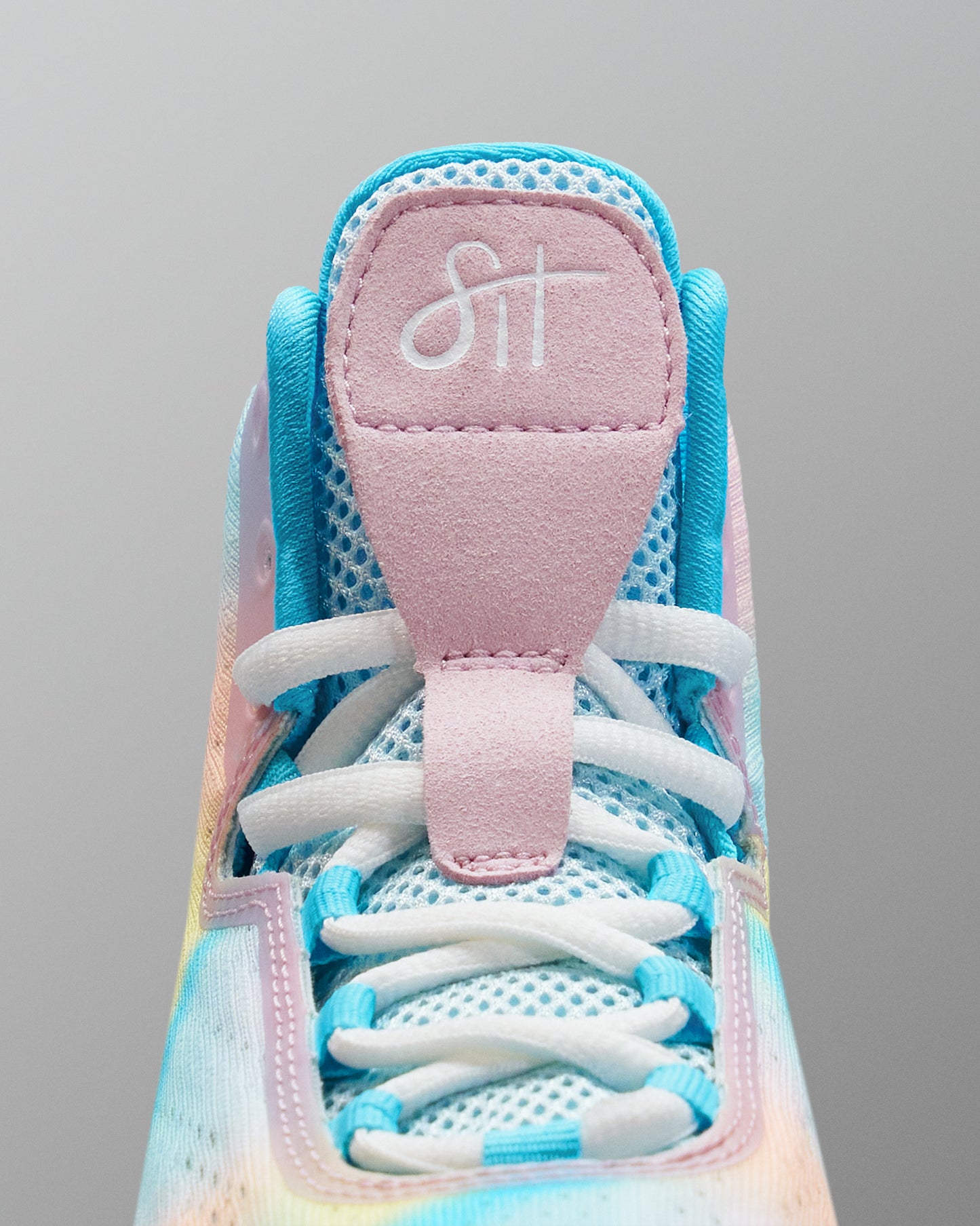 Close-up of a colorful Wrestling shoe with a visible brand logo on a gray background
