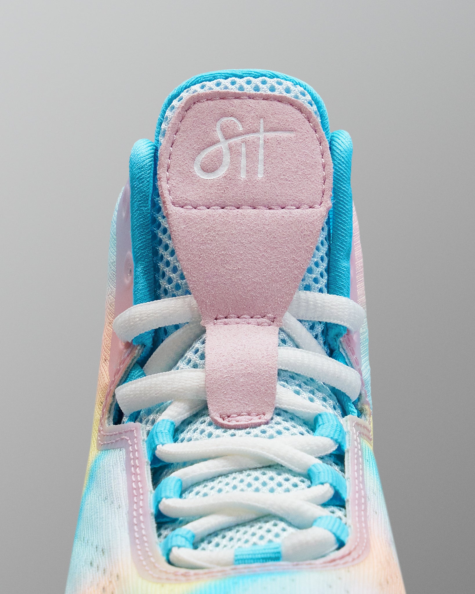 Close-up of a colorful Wrestling shoe with a visible brand logo on a gray background